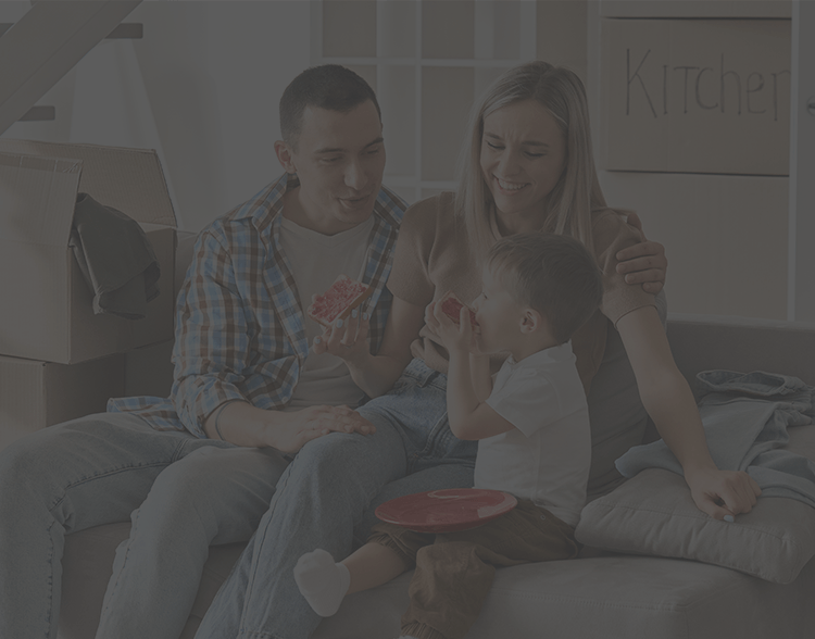 Family in their new home surrounded by boxes